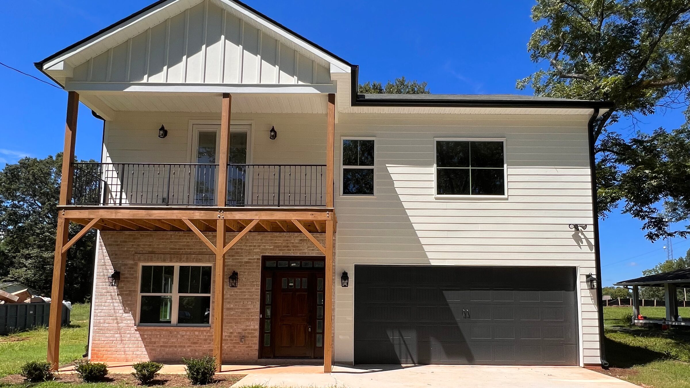 Two-story new-construction custom home with covered porch, built by Bannister Custom Homes in Metro Atlanta.